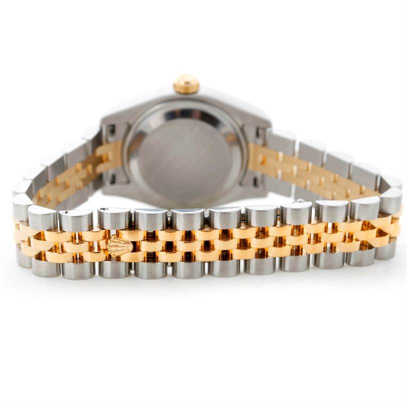 This image shows the back of the Rolex Datejust 179173 Women's Steel and Gold (two tone) Champagne Dial 179173 Women's Steel and Gold (two tone) Champagne Dial watch, highlighting its two-tone jubilee bracelet and Rolex logo on the clasp.