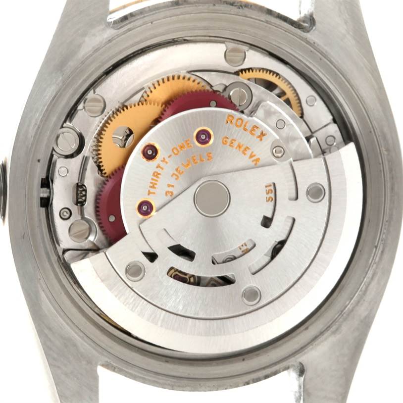 This image shows the movement and inner mechanism of a Rolex Datejust 179173 Women's Steel and Gold (two tone) Champagne Dial 179173 Women's Steel and Gold (two tone) Champagne Dial watch from the back.