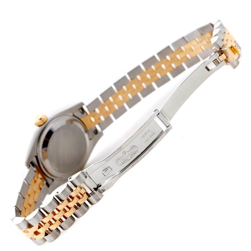This image shows the underside of a Rolex Datejust 179173 Women's Steel and Gold (two tone) Champagne Dial 179173 Women's Steel and Gold (two tone) Champagne Dial watch, highlighting its clasp and bicolor bracelet.