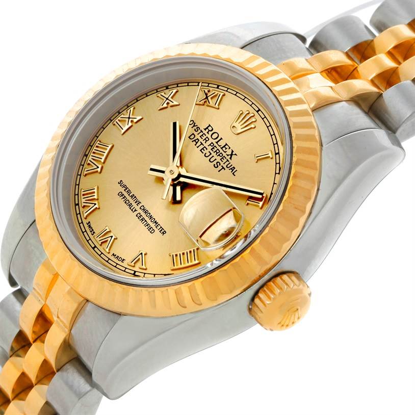 The Rolex Datejust 179173 Women's Steel and Gold (two tone) Champagne Dial 179173 Women's Steel and Gold (two tone) Champagne Dial watch is shown at an angle focusing on the face, crown, and part of the band.