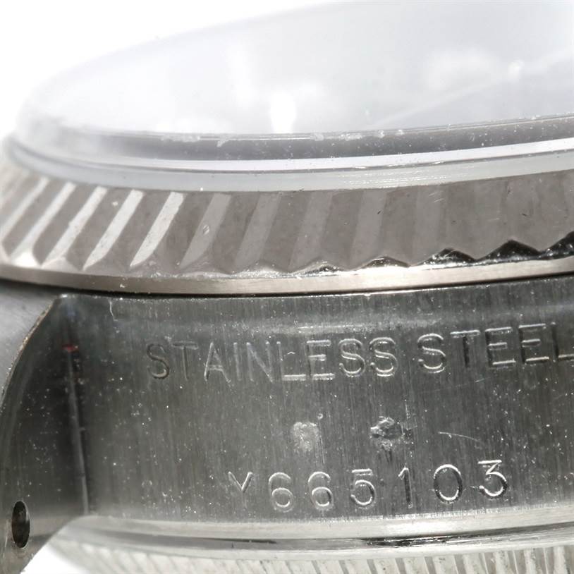 This image shows a close-up of the side casing and bezel of a Rolex Datejust 79174 Women's Stainless Steel Blue Dial 79174 Women's Stainless Steel Blue Dial watch.