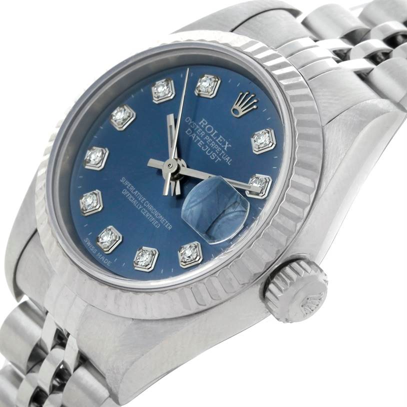 The Rolex Datejust 79174 Women's Stainless Steel Blue Dial 79174 Women's Stainless Steel Blue Dial model watch is shown at an angled close-up, highlighting its blue dial, fluted bezel, crown, and bracelet.