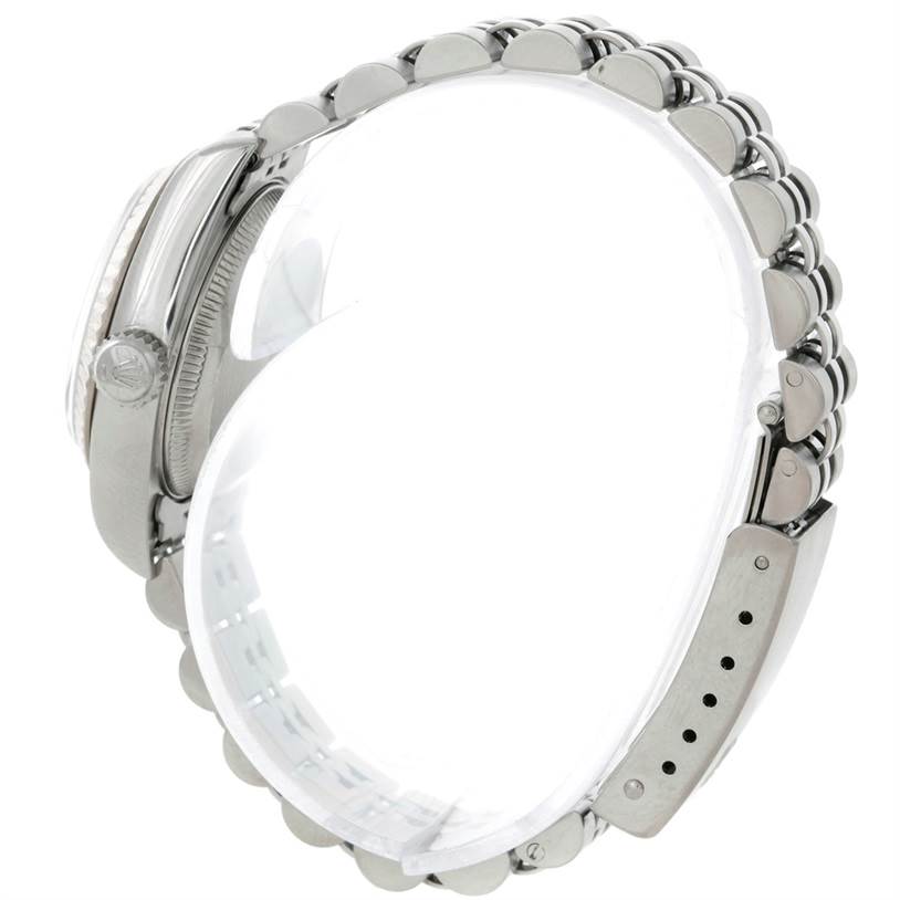 The image shows a side view of the Rolex Datejust 79174 Women's Stainless Steel Blue Dial 79174 Women's Stainless Steel Blue Dial watch, highlighting its case, crown, and bracelet.