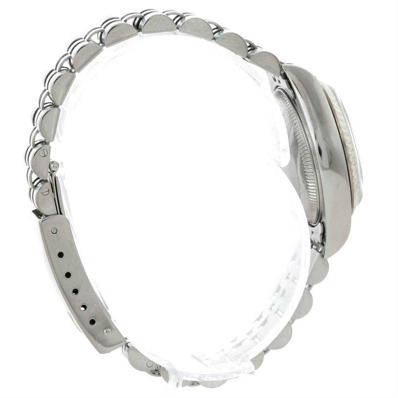 Side view of a Rolex Datejust 79174 Women's Stainless Steel Blue Dial 79174 Women's Stainless Steel Blue Dial watch showing the bracelet, clasp, and case.