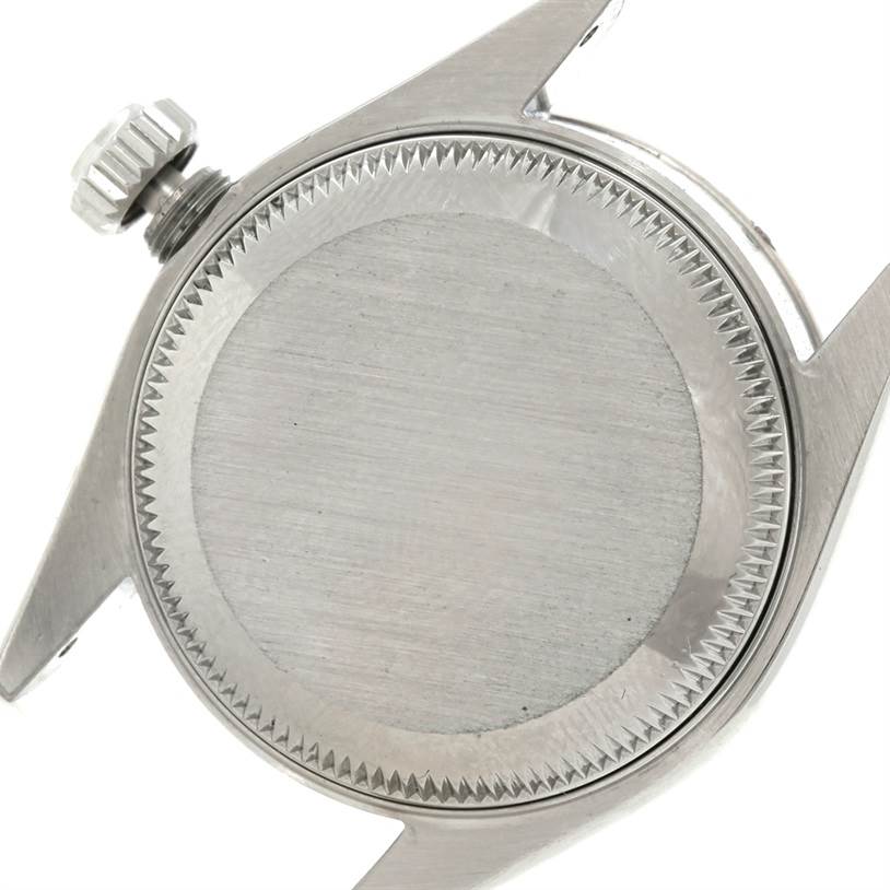 This image shows the back and side of the Rolex Datejust 79174 Women's Stainless Steel Blue Dial 79174 Women's Stainless Steel Blue Dial watch case and crown.