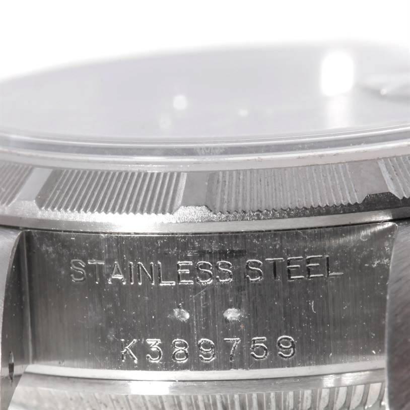 The image shows a close-up side angle of a Rolex Datejust 79190 Women's Stainless Steel Blue Dial 79190 Women's Stainless Steel Blue Dial watch, highlighting the stainless steel case and serial number.