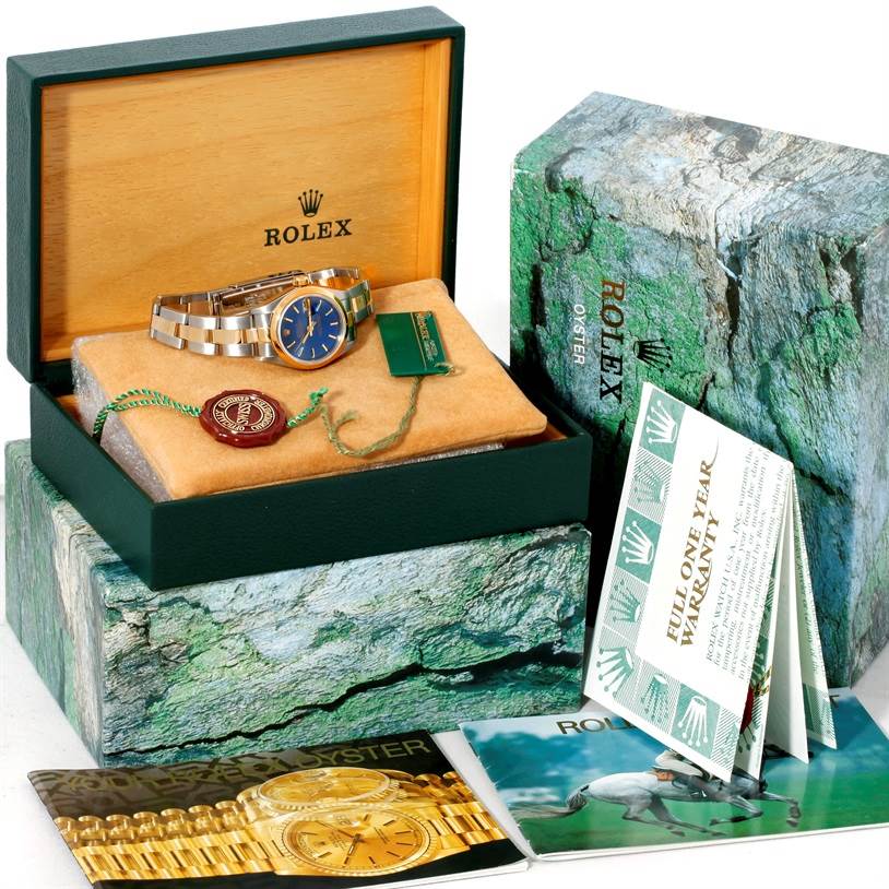 The image shows the Rolex Datejust 69163 Women's Stainless Steel Blue Dial 69163 Women's Stainless Steel Blue Dial watch with its bracelet, box, tags, and warranty booklets.