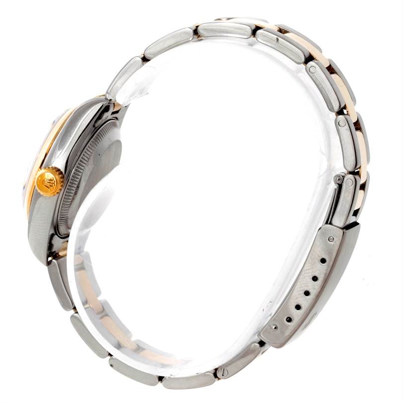 This image shows a side view of a Rolex Datejust 69163 Women's Stainless Steel Blue Dial 69163 Women's Stainless Steel Blue Dial watch, focusing on its crown, case, and bracelet.