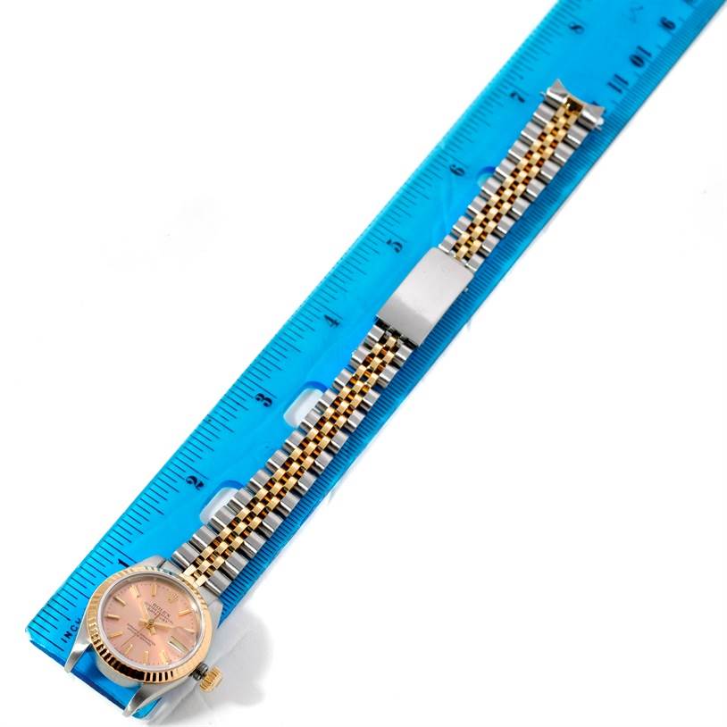 The image shows a Rolex Datejust 69173 Women's Stainless Steel Pink Dial 69173 Women's Stainless Steel Pink Dial watch laid flat next to a blue ruler, displaying the watch face and band.