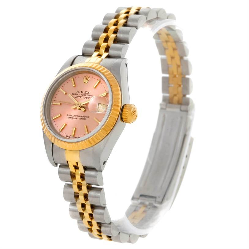 The image shows a Rolex Datejust 69173 Women's Stainless Steel Pink Dial 69173 Women's Stainless Steel Pink Dial watch with a two-tone bracelet, a pink dial, and a gold bezel angled slightly to emphasize the side and face.