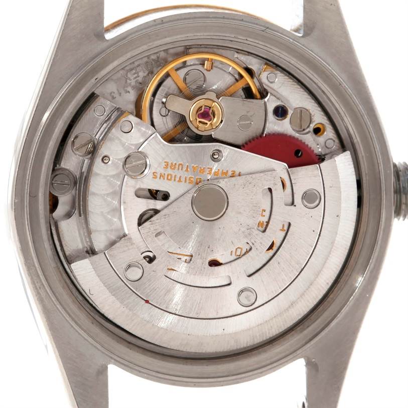 This image shows the back view of a Rolex Datejust 69173 Women's Stainless Steel Pink Dial 69173 Women's Stainless Steel Pink Dial watch, highlighting its internal mechanical movement components.