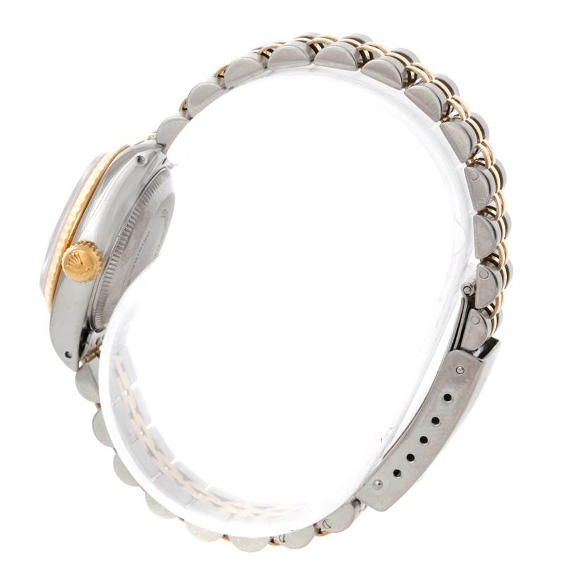 The image shows a side view of a Rolex Datejust 69173 Women's Stainless Steel Pink Dial 69173 Women's Stainless Steel Pink Dial watch featuring the crown, case, and bracelet.