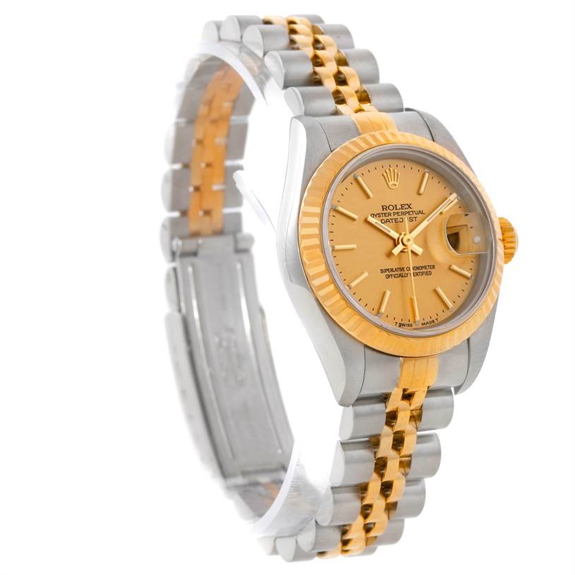 The image shows a Rolex Datejust 79173 Women's Stainless Steel Champagne Dial 79173 Women's Stainless Steel Champagne Dial watch at a three-quarter angle, highlighting its face, bezel, and two-tone bracelet.