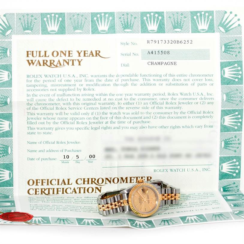 The image shows a Rolex Datejust 79173 Women's Stainless Steel Champagne Dial 79173 Women's Stainless Steel Champagne Dial watch alongside its warranty and chronometer certification papers.
