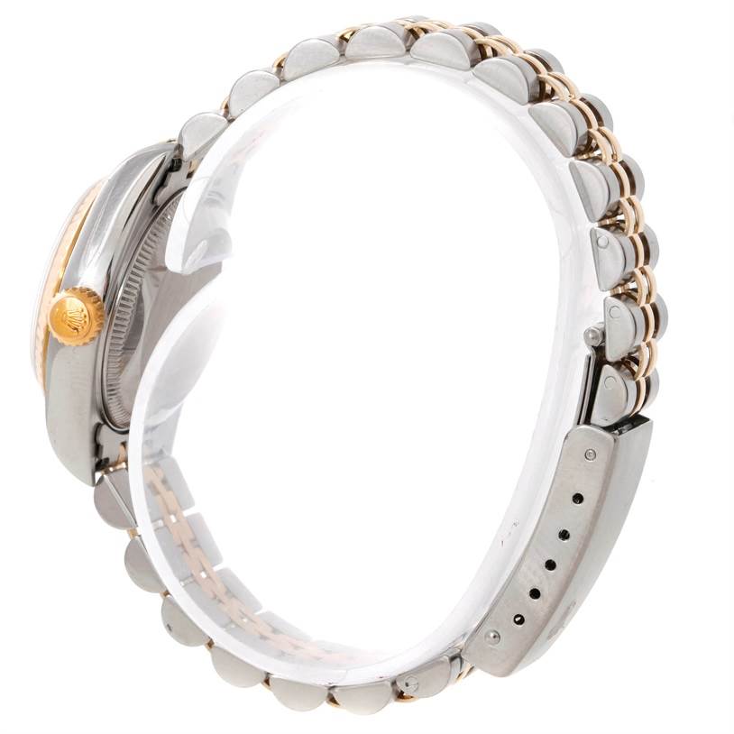 The image shows a side view of the Rolex Datejust 79173 Women's Stainless Steel Champagne Dial 79173 Women's Stainless Steel Champagne Dial watch focusing on the crown, bezel, and Jubilee bracelet.