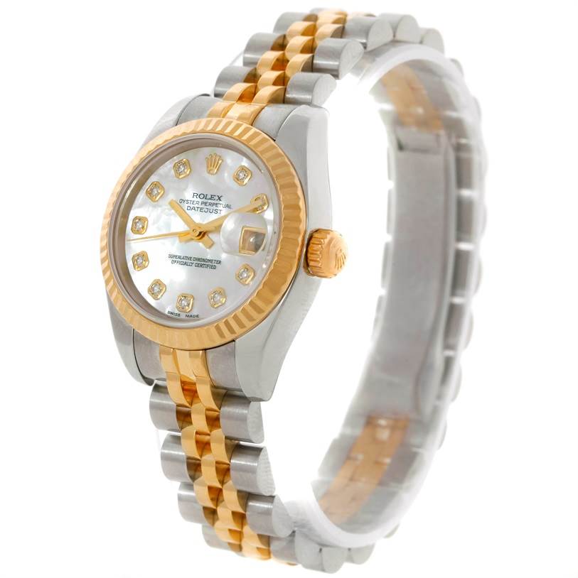 The image shows a side angle view of the Rolex Datejust 179173 Women's Steel and Gold (two tone) Mother of Pearl Dial 179173 Women's Steel and Gold (two tone) Mother of Pearl Dial watch, displaying its two-tone bracelet, dial, crown, and fluted bezel.