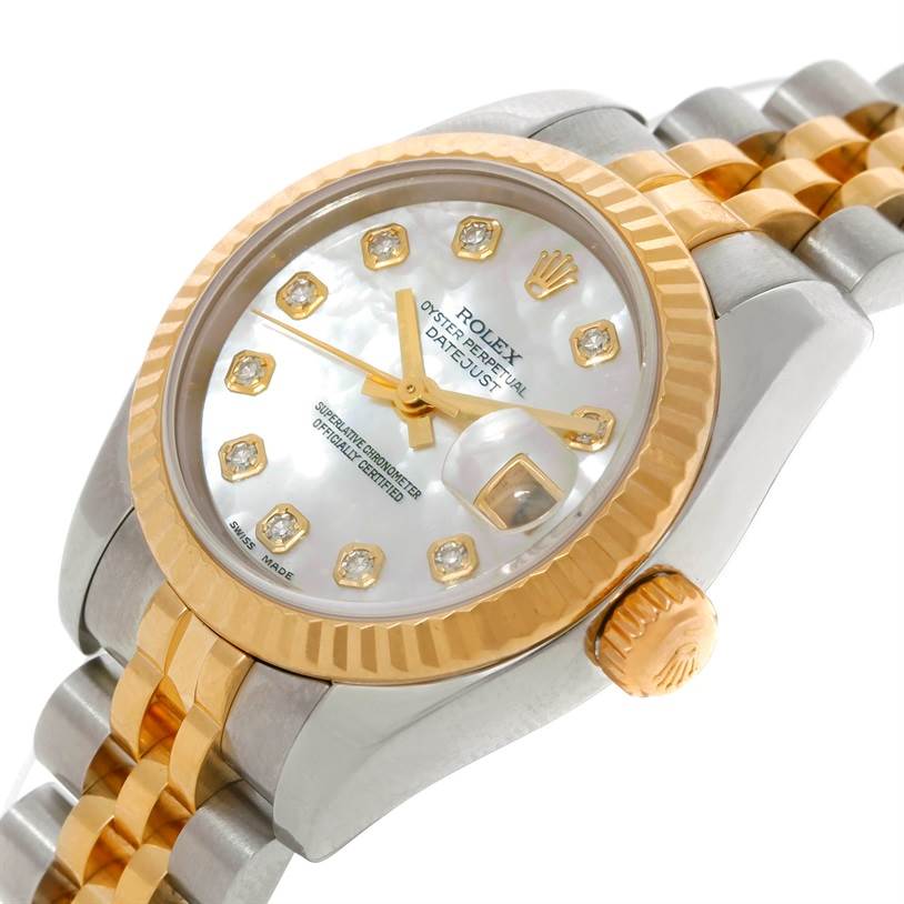 This Rolex Datejust 179173 Women's Steel and Gold (two tone) Mother of Pearl Dial 179173 Women's Steel and Gold (two tone) Mother of Pearl Dial watch is shown from a close-up angle, highlighting the dial, bezel, crown, and part of the bracelet.