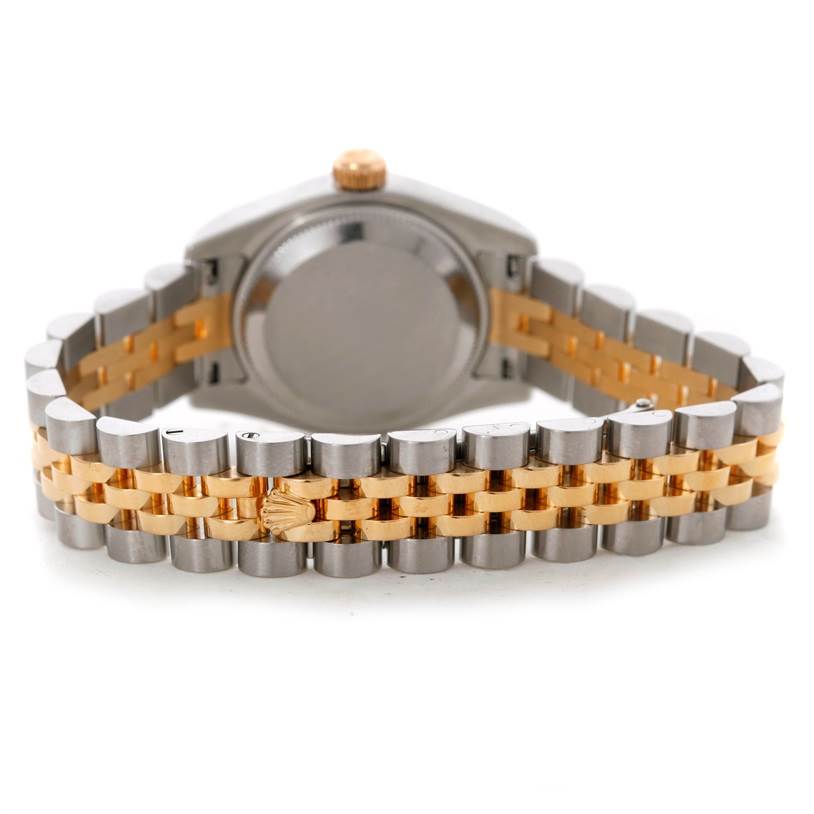 The image shows the back view of a Rolex Datejust 179173 Women's Steel and Gold (two tone) Mother of Pearl Dial 179173 Women's Steel and Gold (two tone) Mother of Pearl Dial watch, focusing on the case back and two-tone Jubilee bracelet.