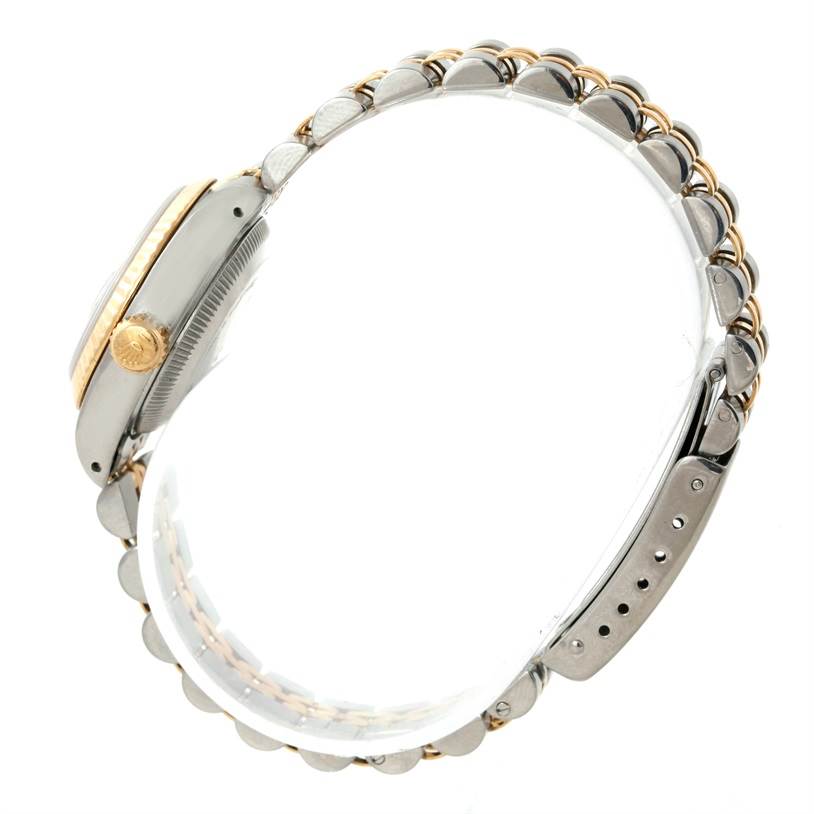 The image shows a side view of a Rolex Datejust 69173 Women
s Stainless Steel Black Dial 69173 Women
s Stainless Steel Black Dial watch, highlighting its crown, case, and two-tone bracelet.