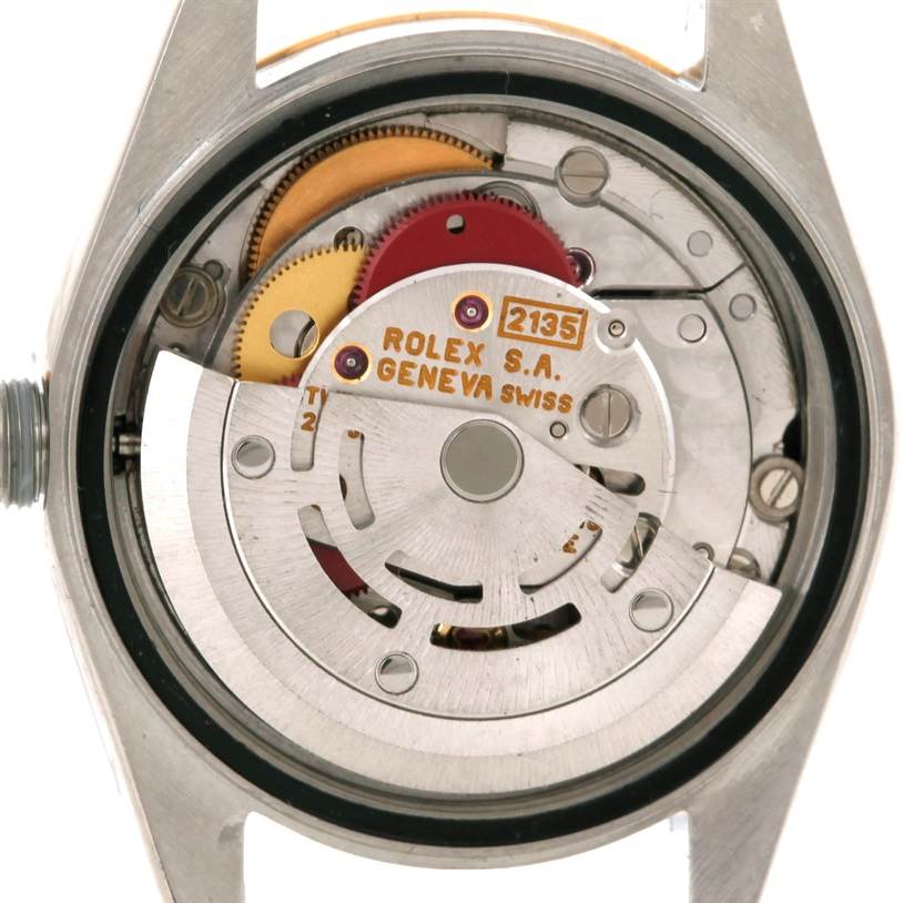 The image shows the internal mechanism and movement of a Rolex Datejust 69173 Women
s Stainless Steel Black Dial 69173 Women
s Stainless Steel Black Dial watch from a caseback angle.