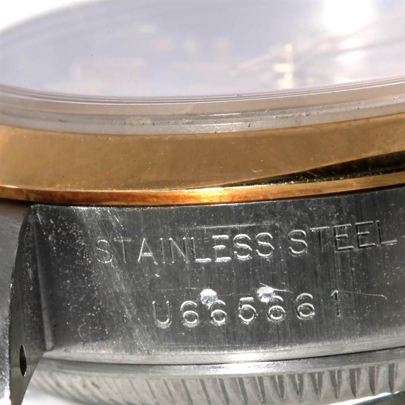 The image shows a close-up view of the stainless steel case and gold bezel of a Rolex Datejust 69173 Women's Stainless Steel Silver Dial 69173 Women's Stainless Steel Silver Dial watch.