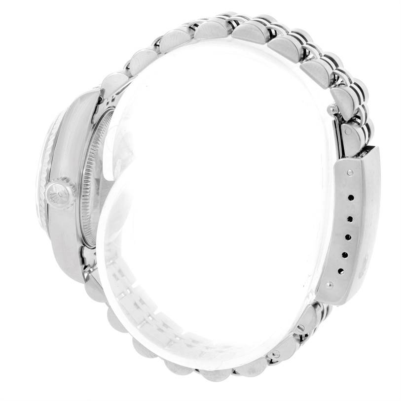 The image shows a side view of a Rolex Datejust 79174 Women's Stainless Steel Blue Dial 79174 Women's Stainless Steel Blue Dial watch focusing on the crown, case, and bracelet.