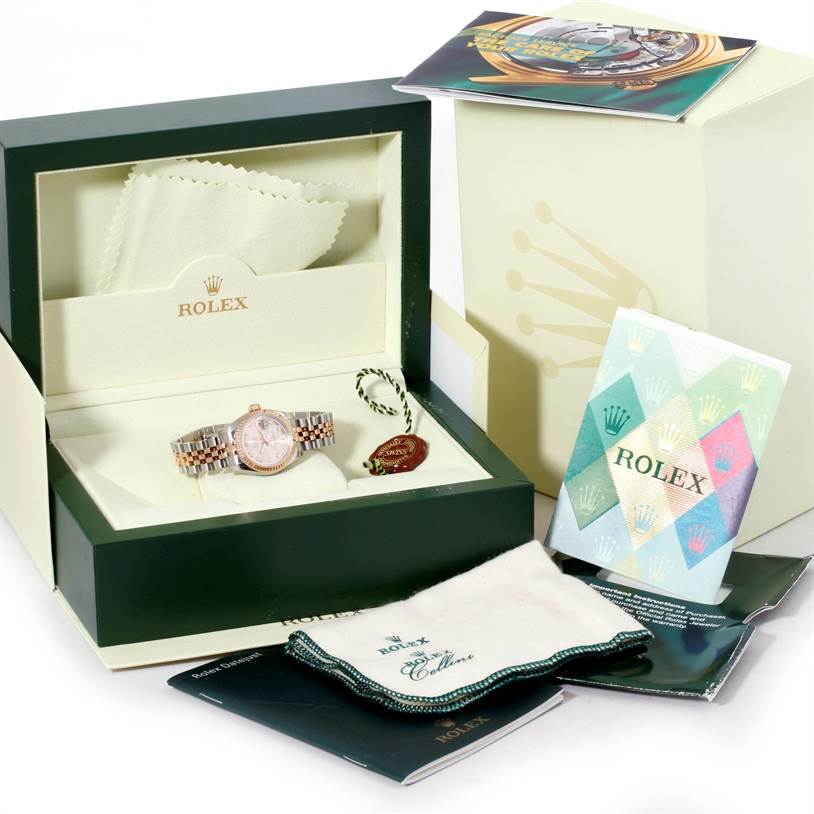 The image shows a Rolex Datejust 179171 Women's Steel and Gold (two tone) Pink Dial 179171 Women's Steel and Gold (two tone) Pink Dial watch, box, cleaning cloth, and instruction booklets.