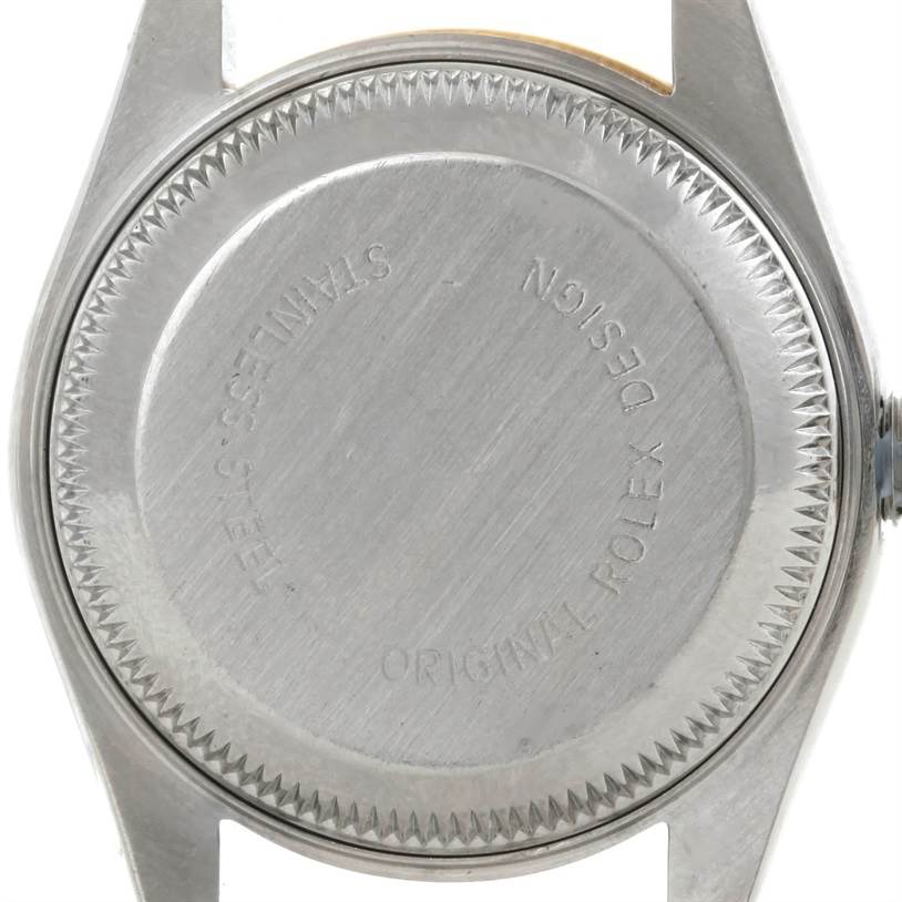 The image shows the back case of a Rolex Datejust 69173 Women
s Stainless Steel Beige Dial 69173 Women
s Stainless Steel Beige Dial watch from a top-down angle.