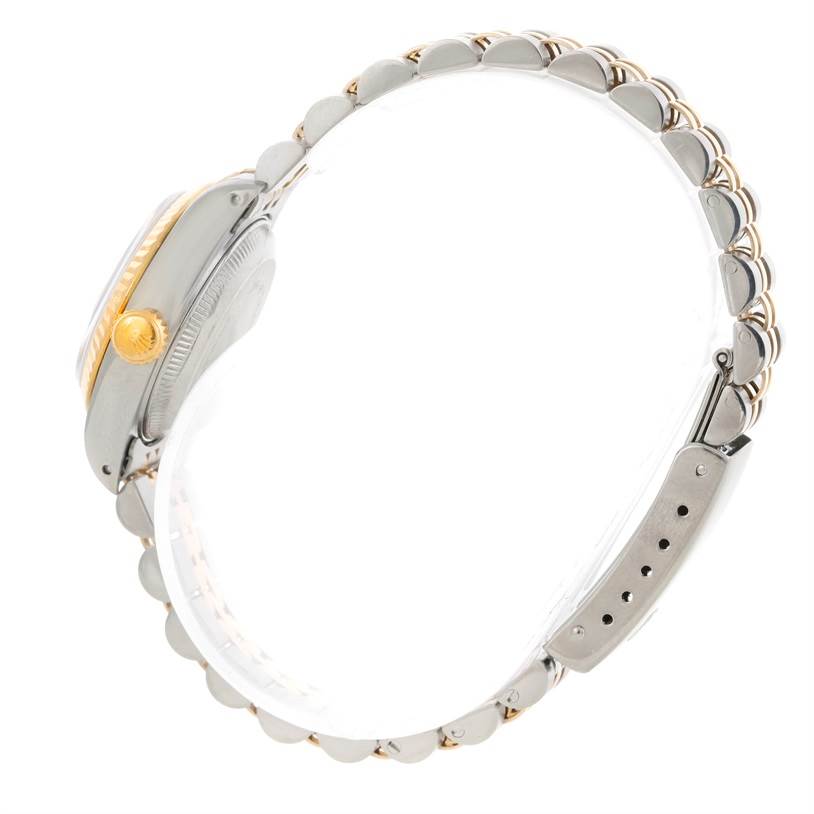 The image shows a side profile of a Rolex Datejust 69173 Women
s Stainless Steel Beige Dial 69173 Women
s Stainless Steel Beige Dial watch, highlighting the crown, case, and partially visible bracelet.