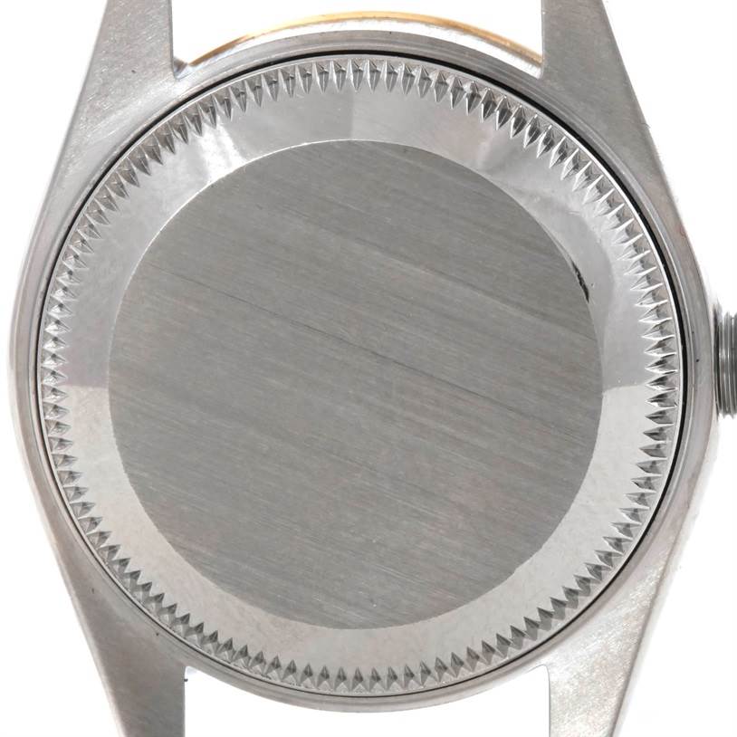 This is the case back of a Rolex Datejust 69173 Women's Stainless Steel Champagne Dial 69173 Women's Stainless Steel Champagne Dial watch, shown from a top-down angle.