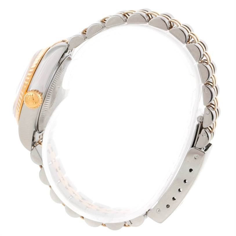 The image shows a side view of a Rolex Datejust 69173 Women's Stainless Steel Champagne Dial 69173 Women's Stainless Steel Champagne Dial watch, highlighting the case, crown, and two-tone bracelet.