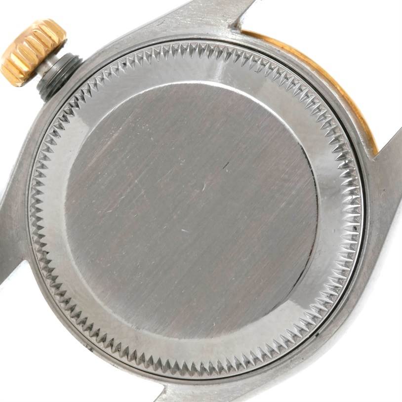 This image shows the case back and crown of the Rolex Datejust 69173 Men's Stainless Steel Beige Dial 69173 Men's Stainless Steel Beige Dial watch at a top-down angle.