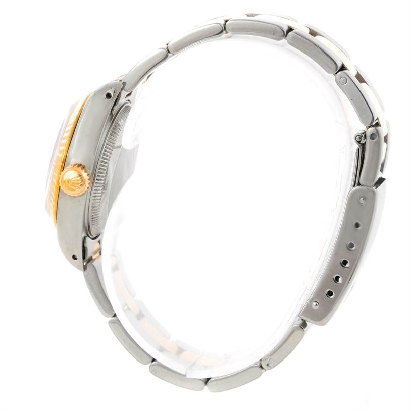 The image shows a side view of a Rolex Datejust 69173 Men's Stainless Steel Beige Dial 69173 Men's Stainless Steel Beige Dial watch, highlighting its crown, bezel, and bracelet.