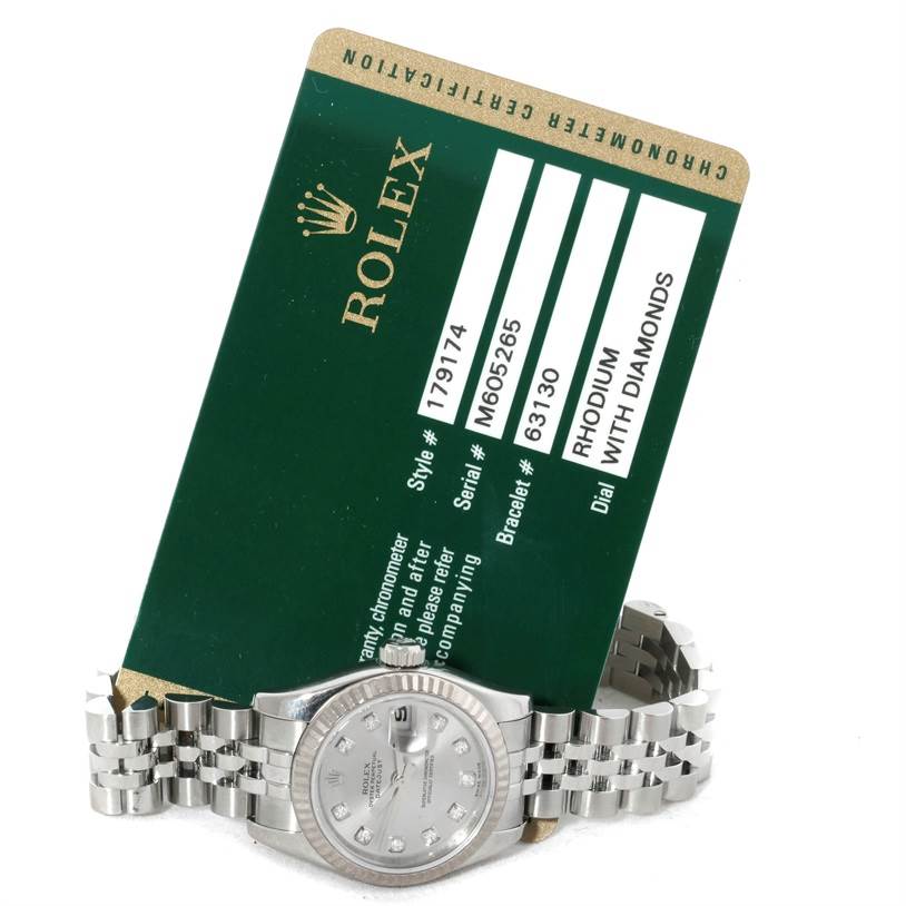 The Rolex Datejust 179174 Women's Stainless Steel Silver Dial 179174 Women's Stainless Steel Silver Dial watch is shown from a front angle, displaying the face, bracelet, and certification card.
