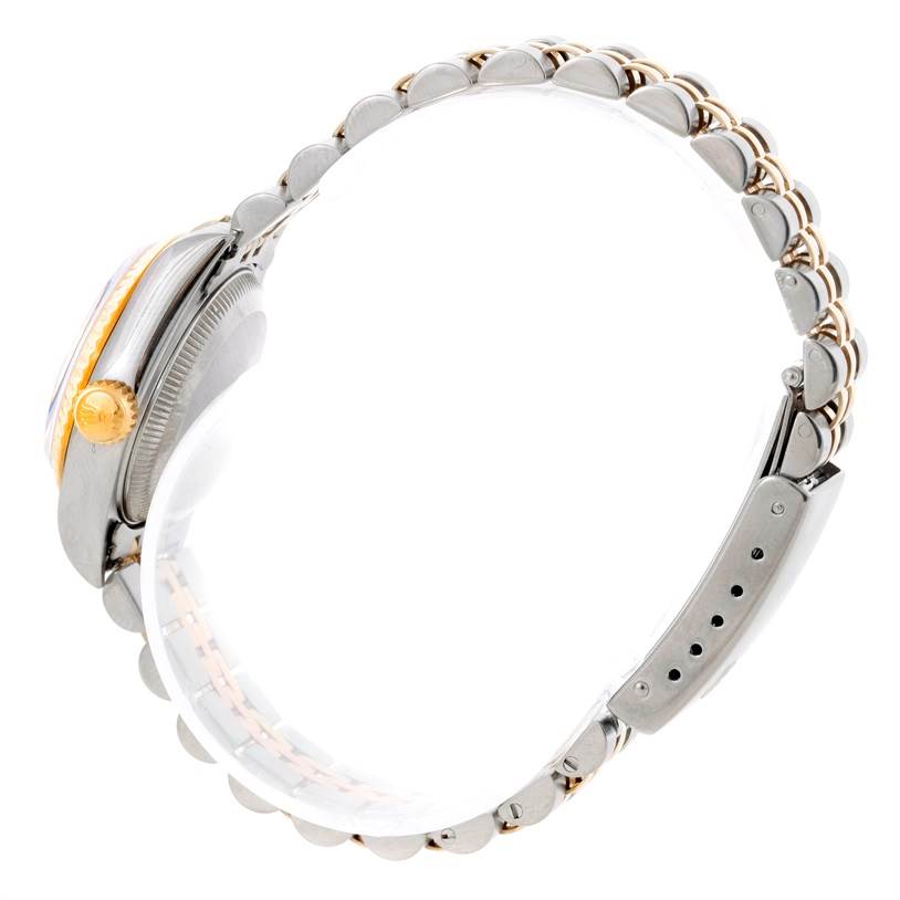 The image shows a side view of the Rolex Datejust 69173 Women's Stainless Steel Blue Dial 69173 Women's Stainless Steel Blue Dial watch, highlighting its crown, case, and bracelet.