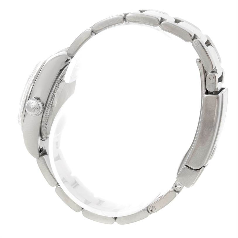 This side-view image of a Rolex Datejust 179174 Women's Stainless Steel Mother of Pearl Dial 179174 Women's Stainless Steel Mother of Pearl Dial watch displays the case, crown, and bracelet.