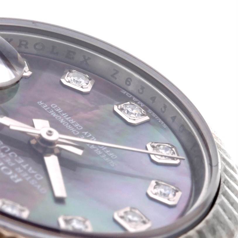 The image shows a close-up view of the dial and bezel of a Rolex Datejust 179174 Women's Stainless Steel Mother of Pearl Dial 179174 Women's Stainless Steel Mother of Pearl Dial, highlighting the diamond hour markers and serial number.