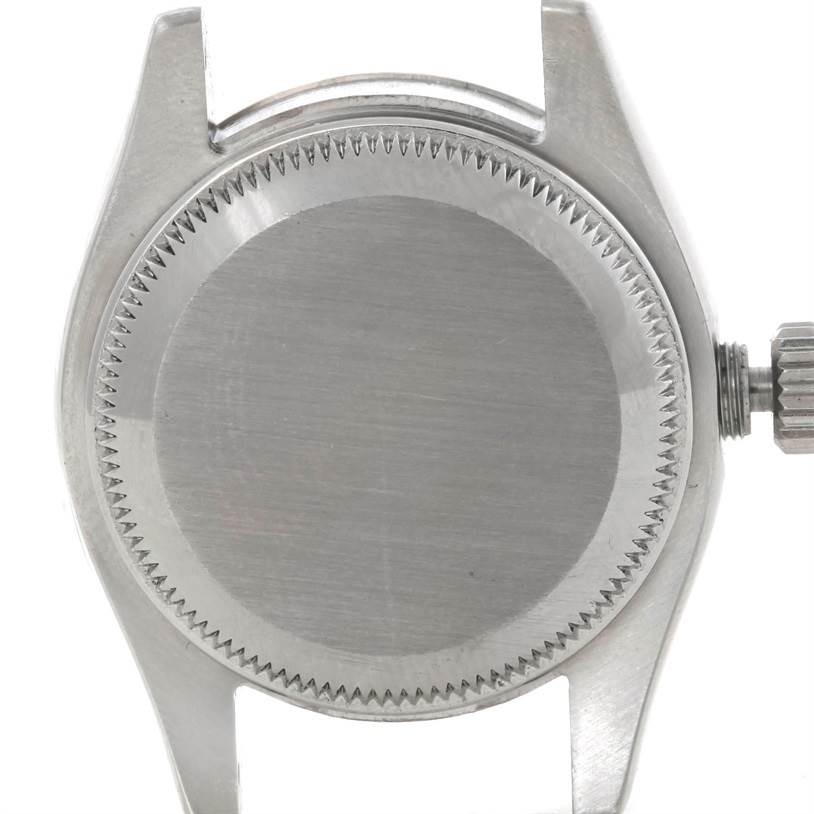 This image shows the back case and part of the crown of a Rolex Datejust 179174 Women's Stainless Steel Mother of Pearl Dial 179174 Women's Stainless Steel Mother of Pearl Dial watch from a top-down angle.