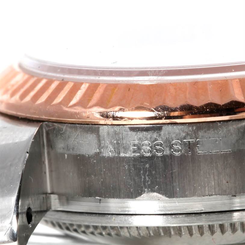 The image shows a close-up side view of the Rolex Datejust 179171 Women's Steel and Gold (two tone) White Dial 179171 Women's Steel and Gold (two tone) White Dial, highlighting the fluted bezel and stainless steel case.