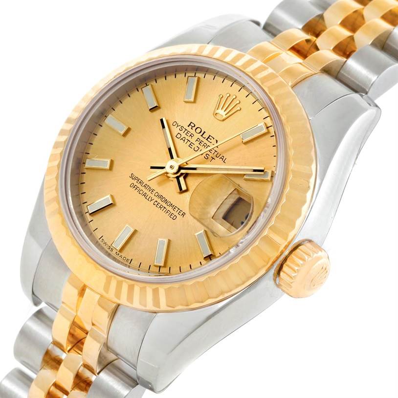 The image shows a close-up angled view of the Rolex Datejust 179173 Women's Steel and Gold (two tone) Champagne Dial 179173 Women's Steel and Gold (two tone) Champagne Dial watch displaying its gold dial, fluted bezel, and Jubilee bracelet.