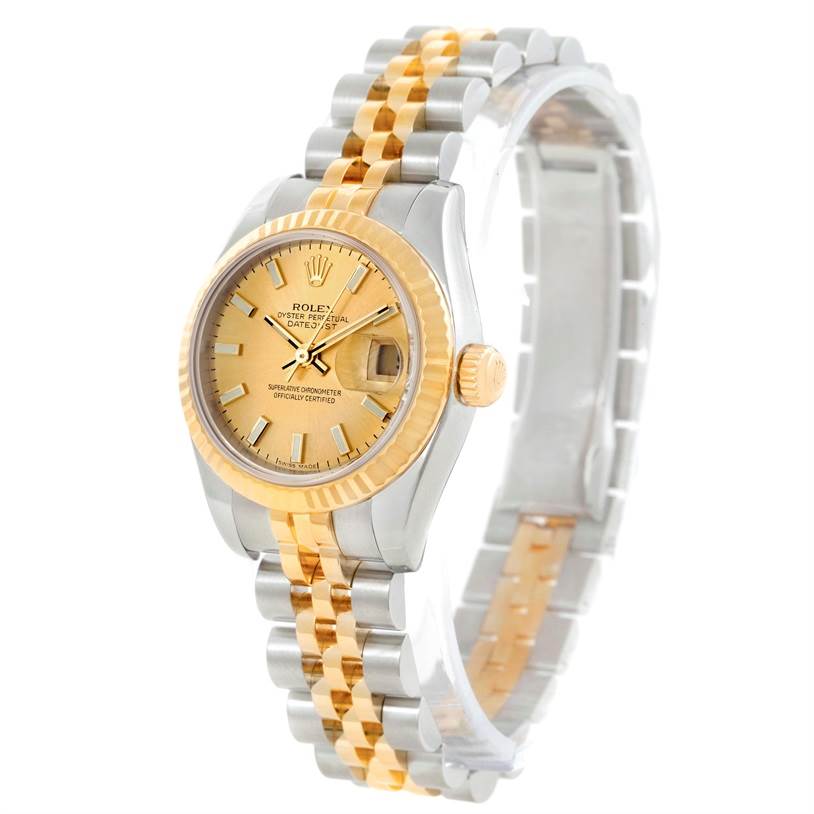 The image shows a Rolex Datejust 179173 Women's Steel and Gold (two tone) Champagne Dial 179173 Women's Steel and Gold (two tone) Champagne Dial watch at an oblique angle, highlighting its two-tone bracelet and oyster case with a fluted bezel.