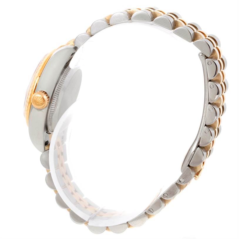 The image shows a side view of the Rolex Datejust 179173 Women's Steel and Gold (two tone) Champagne Dial 179173 Women's Steel and Gold (two tone) Champagne Dial watch, highlighting the crown and the two-tone bracelet.