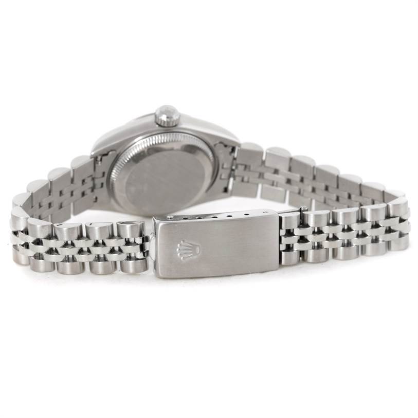 The image shows the back view of a Rolex Datejust 79190 Women's Stainless Steel White Dial 79190 Women's Stainless Steel White Dial watch, highlighting its case, crown, and Jubilee bracelet with clasp.