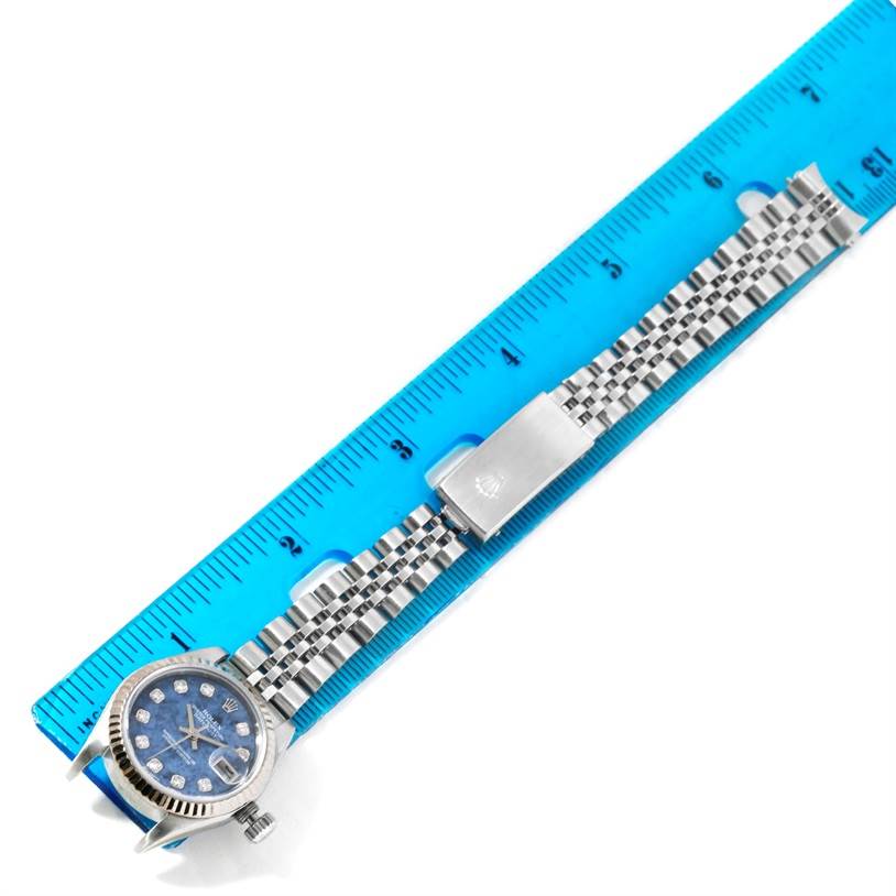 The image shows a Rolex Datejust 79174 Women's Stainless Steel Blue Dial 79174 Women's Stainless Steel Blue Dial watch laid flat with a ruler, displaying the watch face and full bracelet.