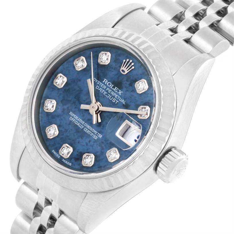 This Rolex Datejust 79174 Women's Stainless Steel Blue Dial 79174 Women's Stainless Steel Blue Dial watch is shown at a slight angle, highlighting its blue dial, diamond markers, bezel, crown, and bracelet.