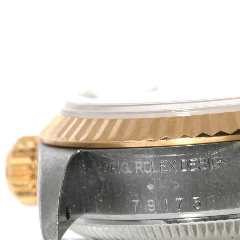 The image shows a close-up angle of the case, bezel, and crown of a Rolex Datejust 79173 Women's Stainless Steel Champagne Dial 79173 Women's Stainless Steel Champagne Dial watch.