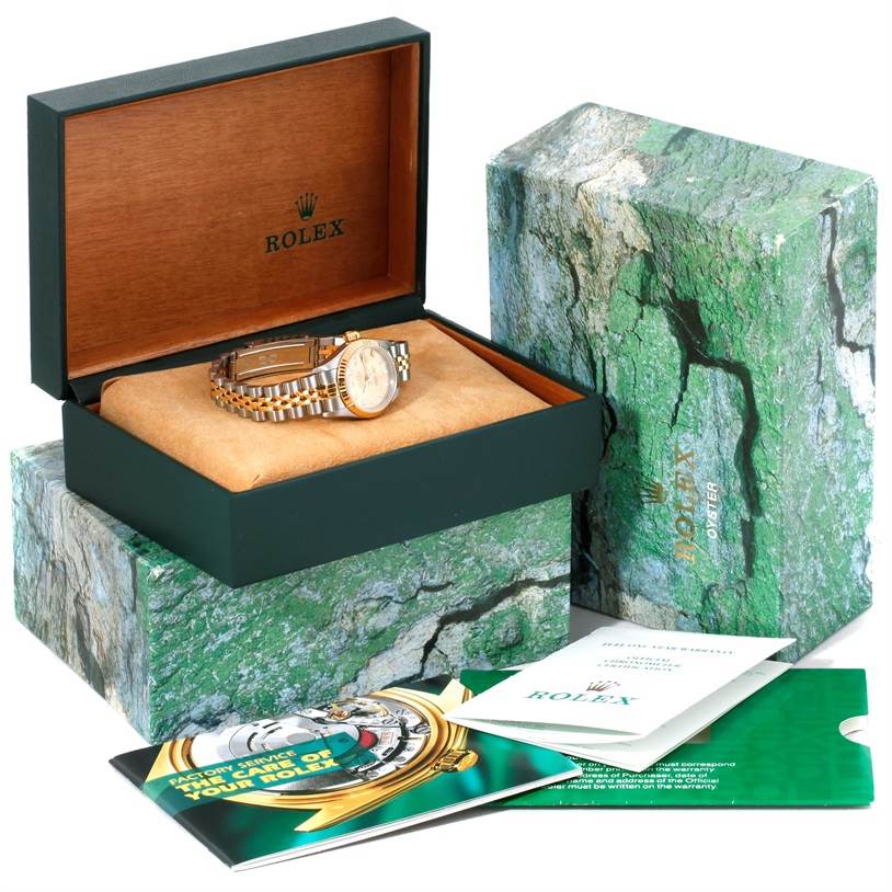 The image shows a Rolex Datejust 79173 Women's Stainless Steel Champagne Dial 79173 Women's Stainless Steel Champagne Dial watch in its open box with accompanying booklets and outer packaging.