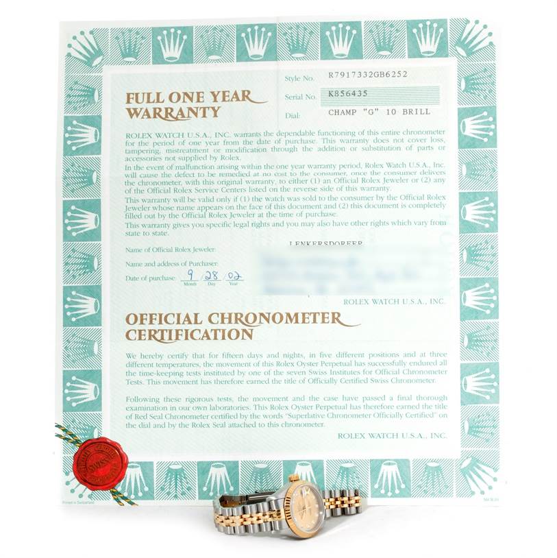 The image shows a Rolex Datejust 79173 Women's Stainless Steel Champagne Dial 79173 Women's Stainless Steel Champagne Dial watch resting in front of its warranty and certification documents.