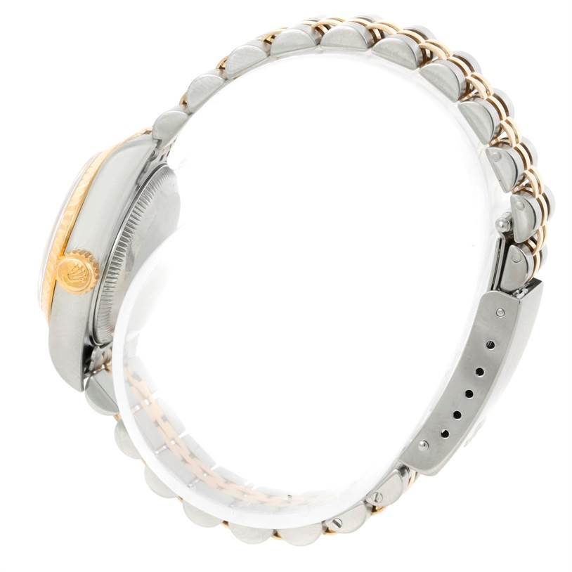 The image shows the side view of a Rolex Datejust 79173 Women's Stainless Steel Champagne Dial 79173 Women's Stainless Steel Champagne Dial watch, highlighting the crown and part of the bracelet.