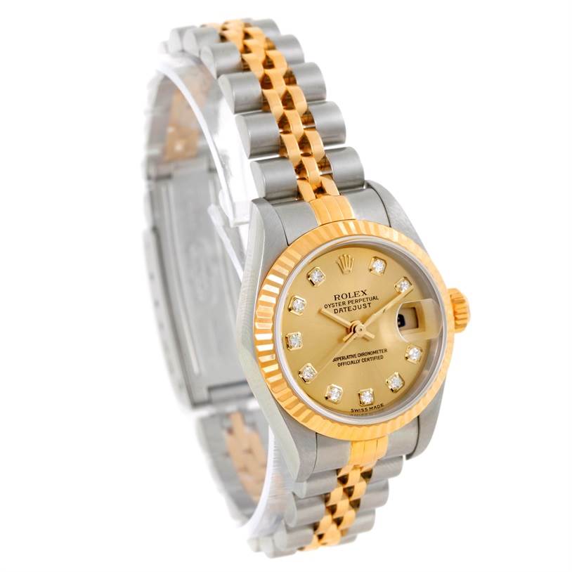 This image shows a Rolex Datejust 79173 Women's Stainless Steel Champagne Dial 79173 Women's Stainless Steel Champagne Dial watch from a front-side angle, highlighting its two-tone bracelet, fluted bezel, and diamond dial.